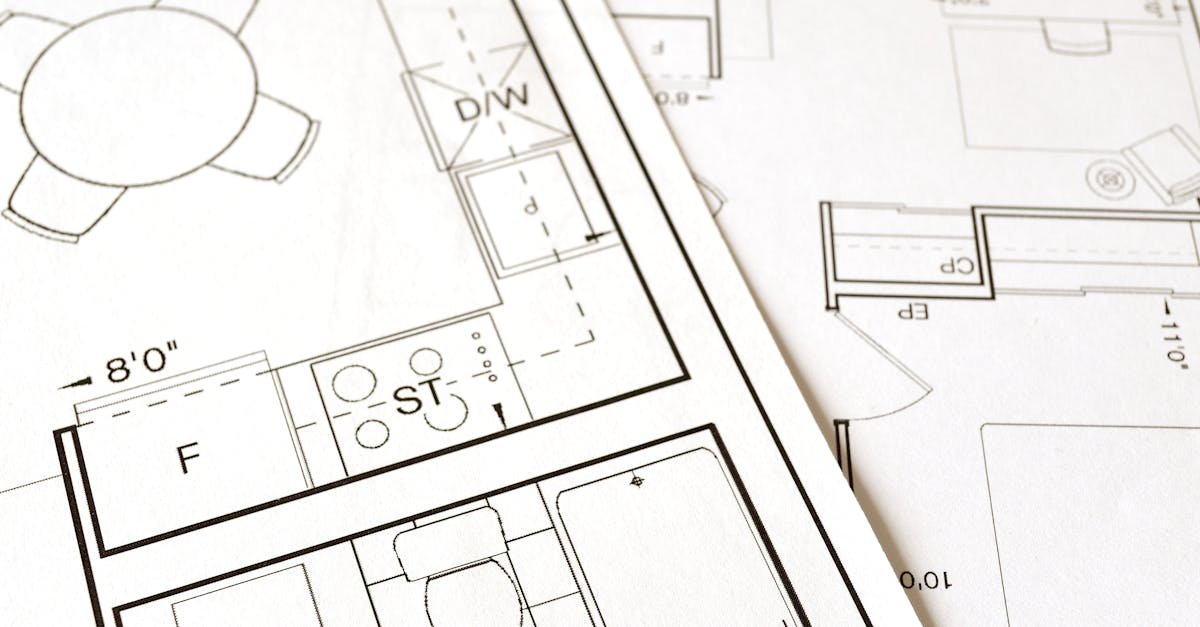 Close-up view of an architectural floor plan on paper showcasing detailed room layouts and measurements.